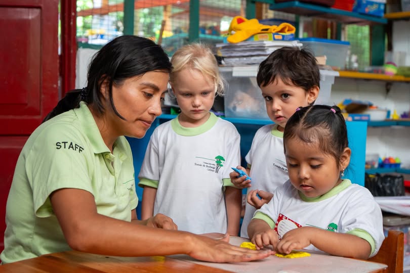  A teacher works with her students at a school funded by Fundación Scalesia.