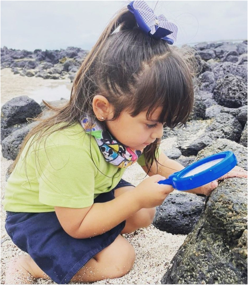 Girl with magnifying glass